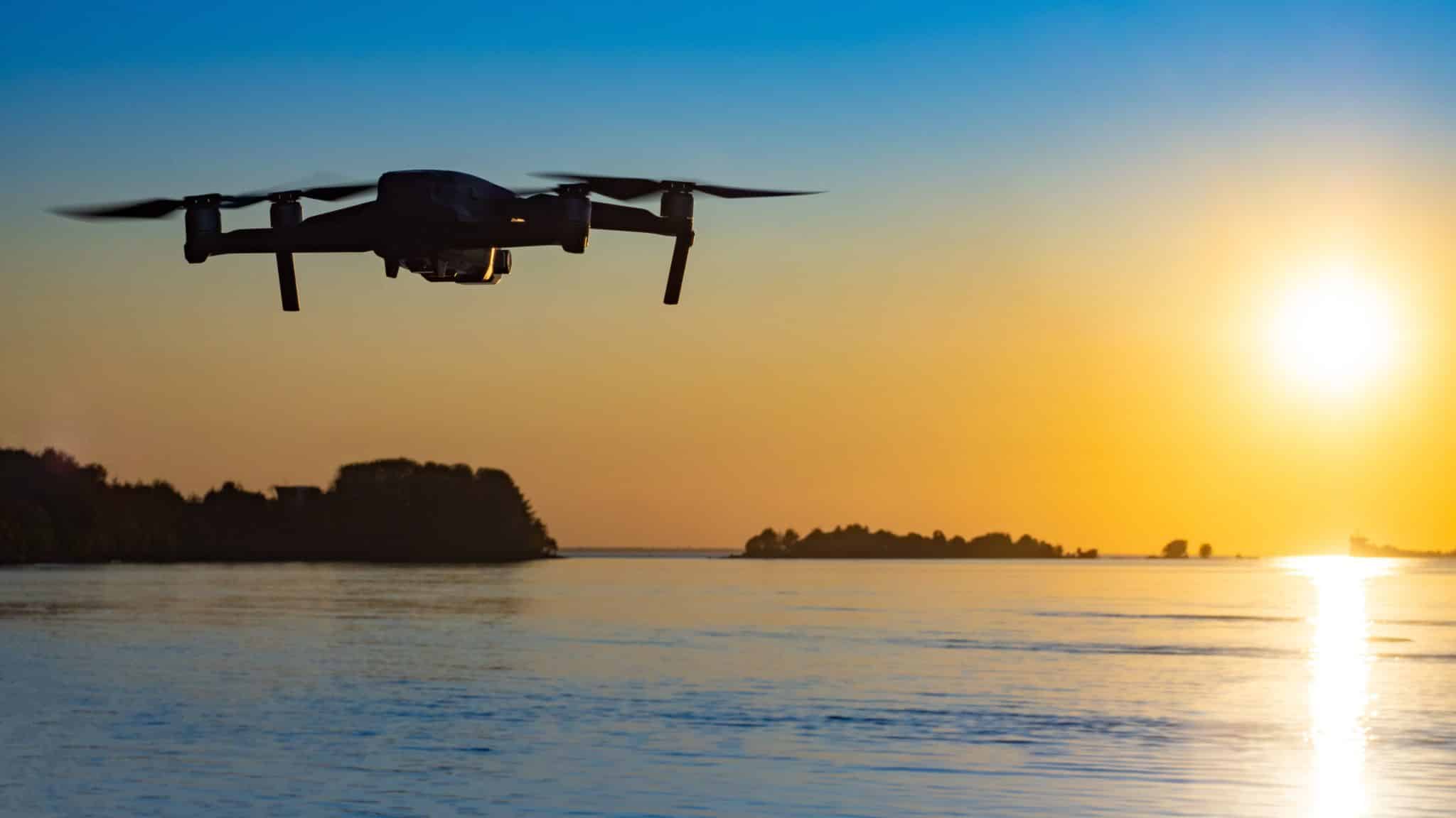 Drone Flying Over Water - Coverdrone